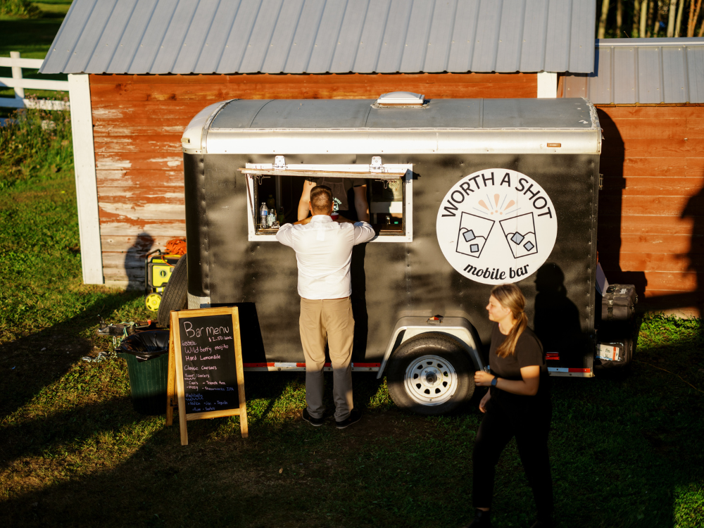 Bartending Trailer with people standing outside and getting drinks