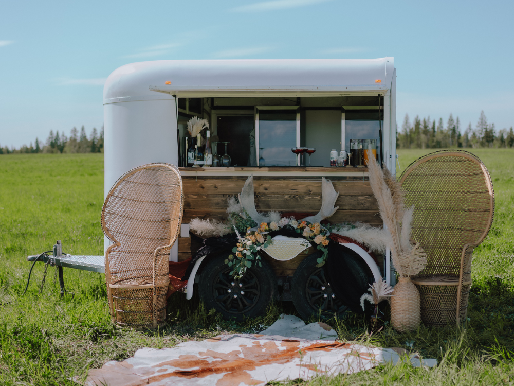 A mobile bar trailer decorated with Western Decor