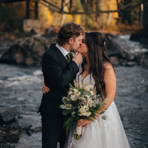 A bride and groom sharing a kiss